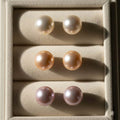 Set of pearl earrings in a jewelry box