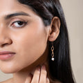 OVAL LINK PEARL DROP EARRING FRONT VIEW ON MODEL