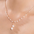 Women whispering twin pearl necklace silver close view with tiny pearl detailing